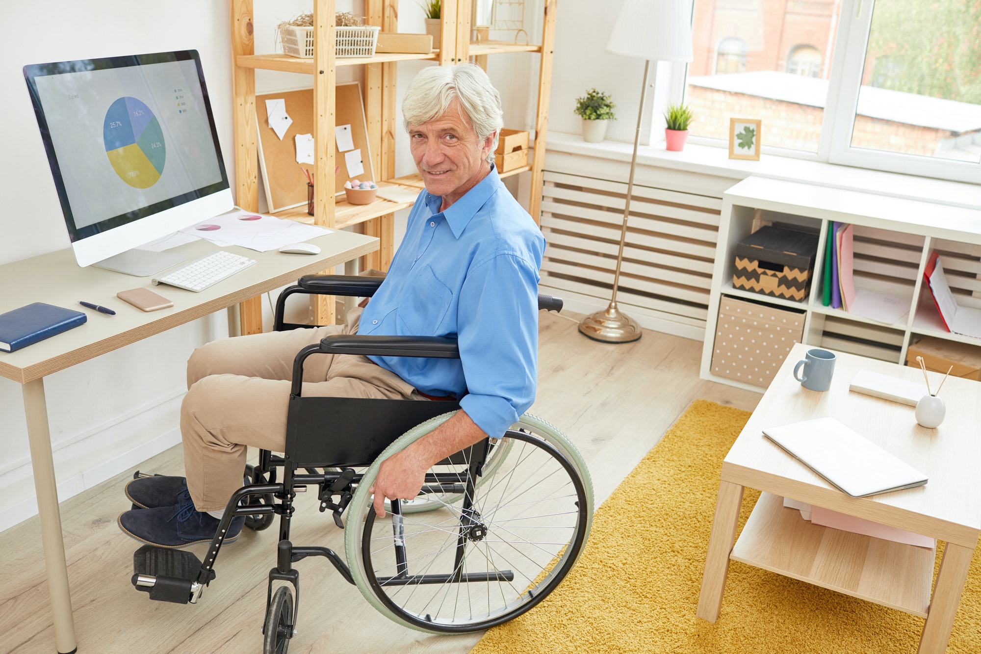 Disabled man working with graphics