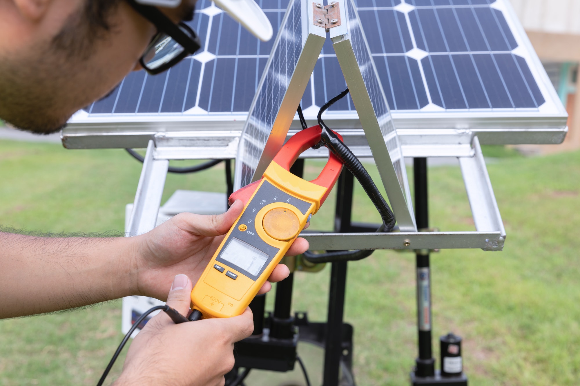 Engineer with energy measurement photovoltaic modules for renewable energy